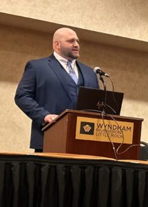 Adam Kennedy, professional life coach in Tulsa, speaks at a leadership event at Wyndham Riverfront Little Rock