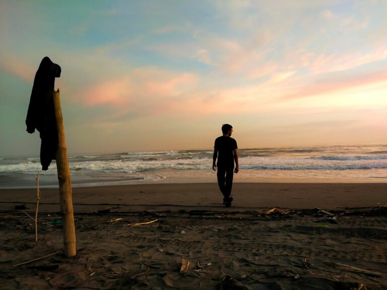 “Person walking on a wooded path during sunrise, symbolizing healing and progress through depression counseling.”