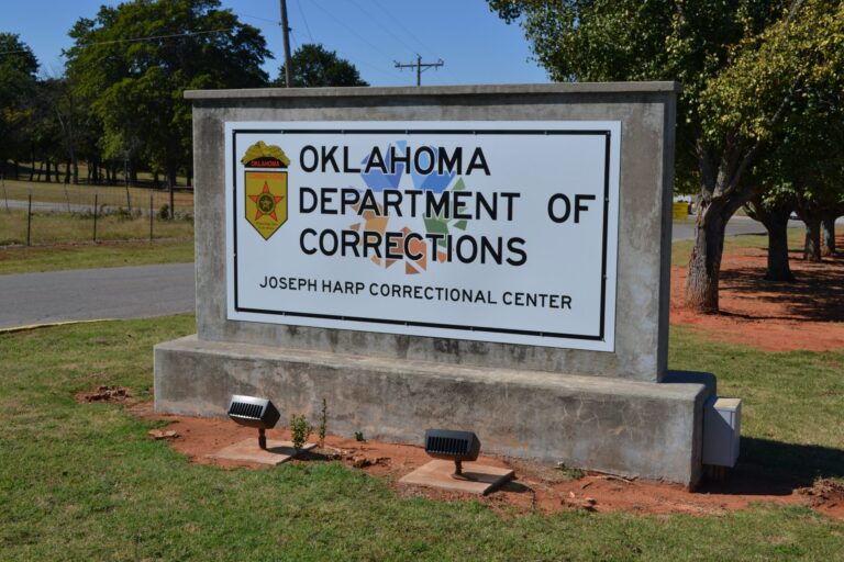 Oklahoma Department of Corrections facility sign related to Oklahoma mental health services realignment